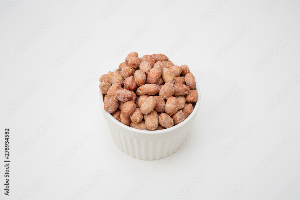 nuts in a bowl isolated on white background nuts in a bowl isolated on white background