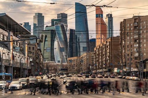 Photography Traffic flows of people and cars at the busy city crossroad