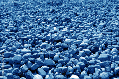 Pile of small gravel stones in navy blue tone.