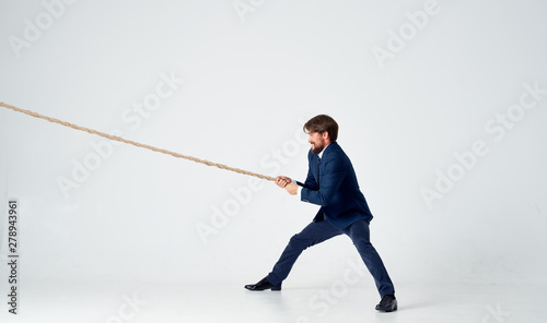 businessman on top of ladder