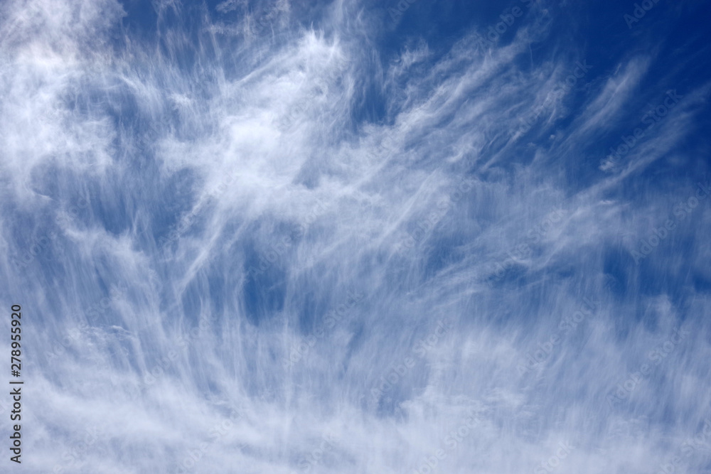 Fototapeta premium Dramatic cirrus clouds formation in the blue sky