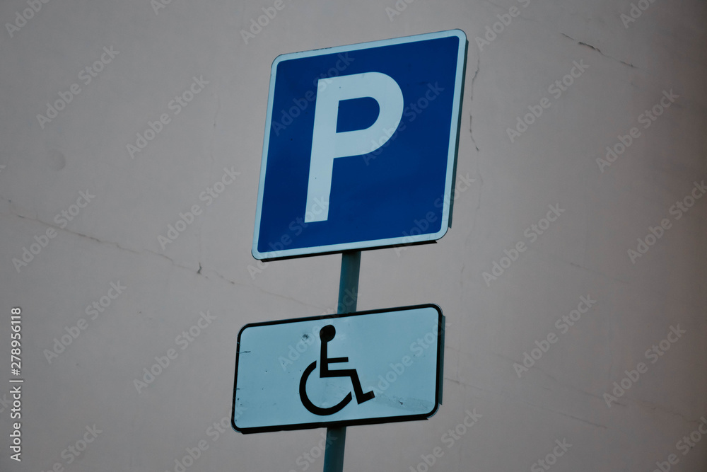 blue Parking sign with disabled sign.