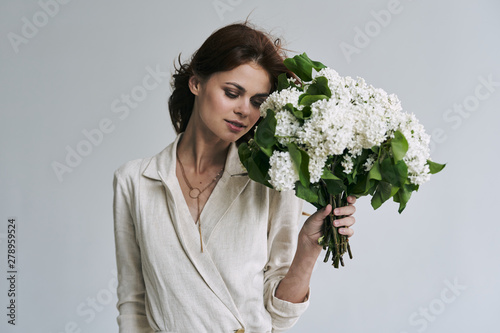 young woman with bouquet of flowers