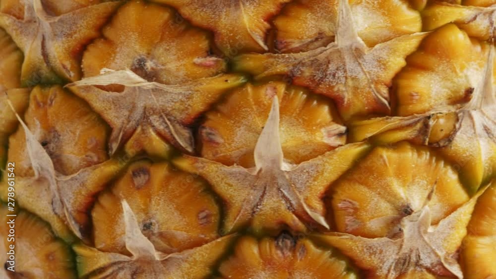 Pineapple fruit, closeup. Rotating background Pineapple fruit, closeup. Rotating background