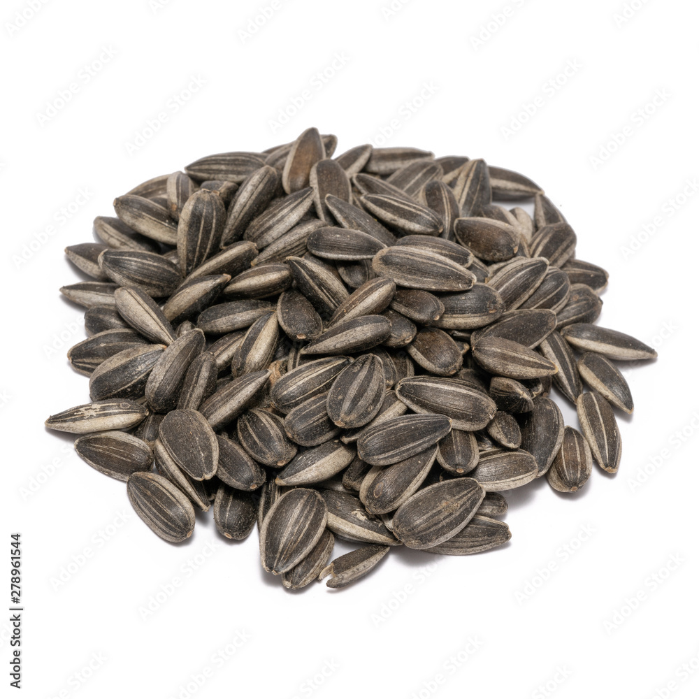 Sunflower seeds close up isolated on white background Sunflower seeds close up isolated on white background