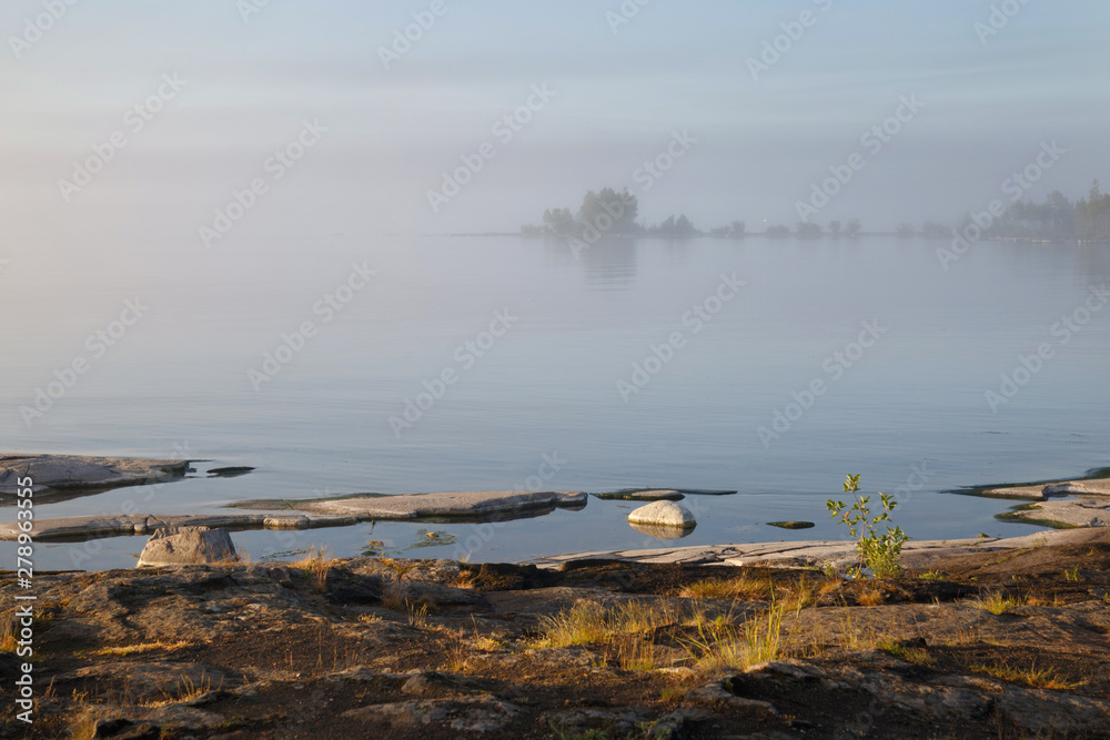 Morning misty landscape on the lake, Valaam, Karelia, Russia.