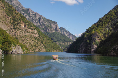 Lake Koman. Breathtaking views of the deep mountain gorges and a narrow valley. The vertical canyons of the lake are sometimes comparable to the Scandinavian fjords. Albania, Shkoder County