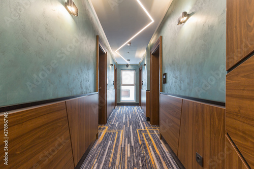 Hotel interior carpeted corridor hallway