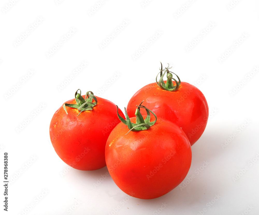 Close-Up Of Red Tomatoes On White Background Close-Up Of Red Tomatoes On White Background