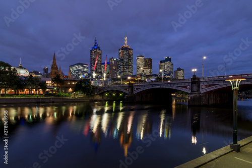 Beautiful view of the city center of Melbourne, Australia, and of the evening Yarra river illuminated by the blue hour light