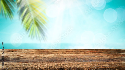 Wooden table background in the beautiful sunny ocean view