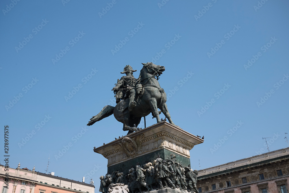 Milan, Italy - June 25, 2019 : View of Vittorio Emanuele II statue in piazza Duomo