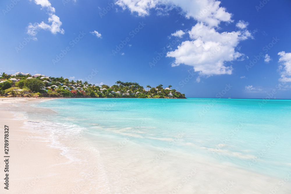 White sandy beach and turquoise waters on carebbian island of St. Maarten