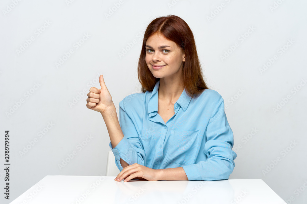 smiling young woman pointing at copy space smiling young woman pointing at copy space
