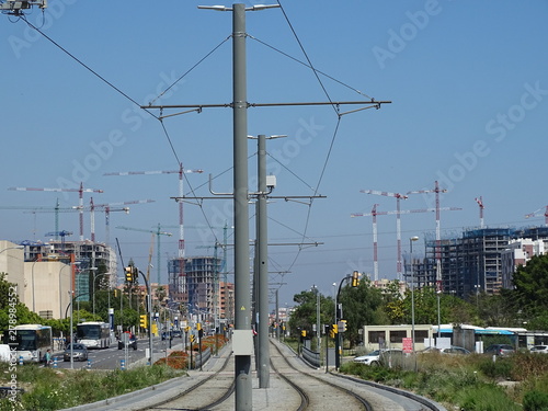 gruas de construccion y vias del tranvia a su paso por teatinos malaga photo