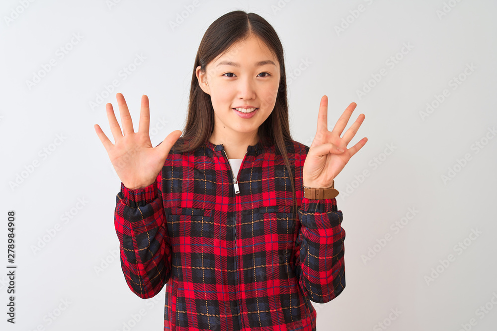 Young chinese woman wearing casual jacket standing over isolated white background showing and pointing up with fingers number nine while smiling confident and happy.