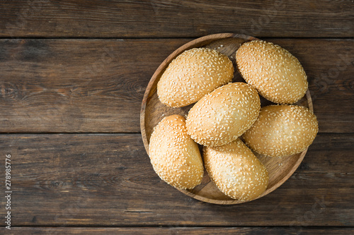 Buns with sesame seeds. Pastry. Rustic style