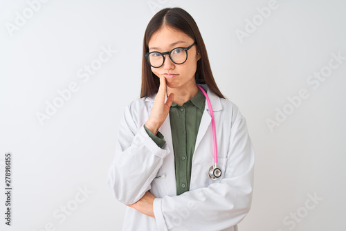 Young chinese dooctor woman wearing glasses stethoscope over isolated white background thinking looking tired and bored with depression problems with crossed arms.