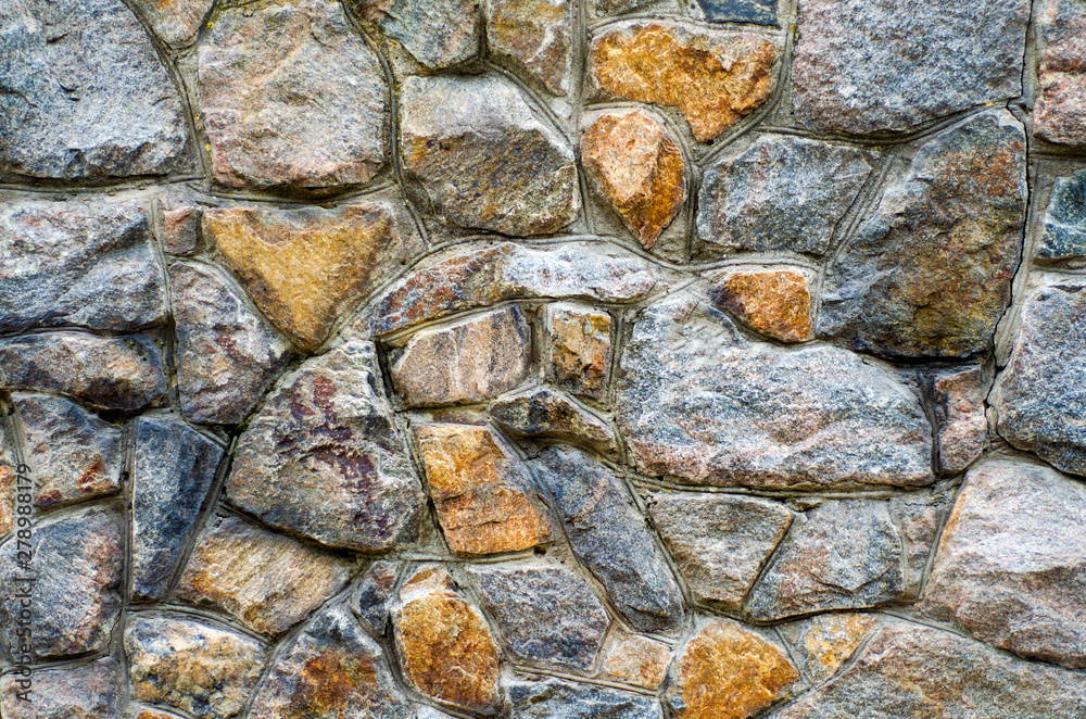 Fototapeta premium Fence of wild stone texture wall art background