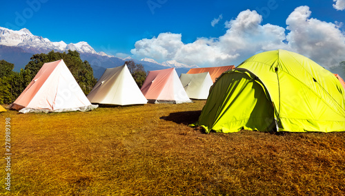 Fototapeta Naklejka Na Ścianę i Meble -  Orange and green tent on the Hill on a sunny day.in australian base camp.