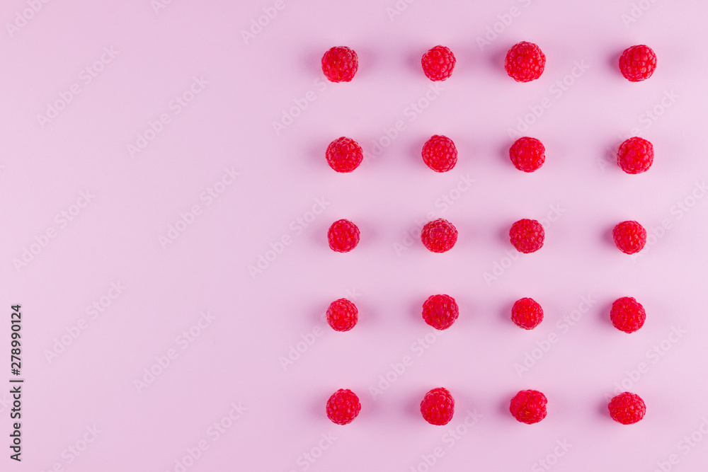 Pattern of raspberries on pink background. Colorful diet and healthy food concept. Background of raspberries. Top view. Flat lay. Copy space Pattern of raspberries on pink background. Colorful diet and healthy food concept. Background of raspberries. Top view. Flat lay. Copy space