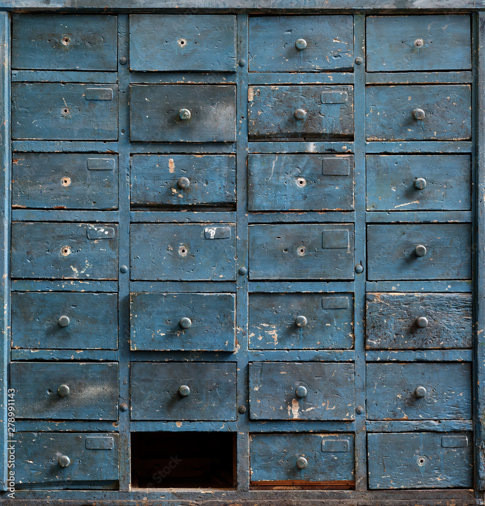 Old blue wooden cabinet with drawers