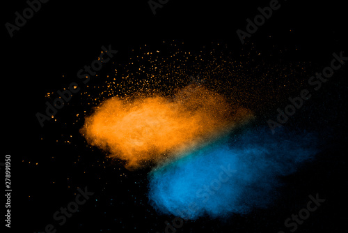 Explosion of multicolored dust on black background.