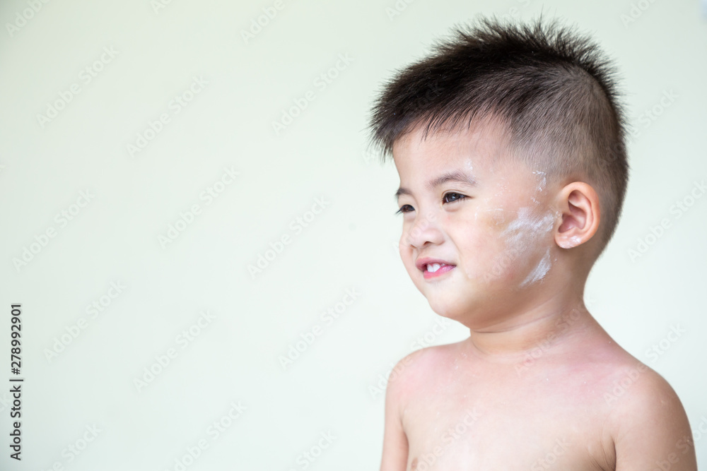 Asian baby boy applied powder on the face, One year ten month old Asian baby boy applied powder on the face, One year ten month old