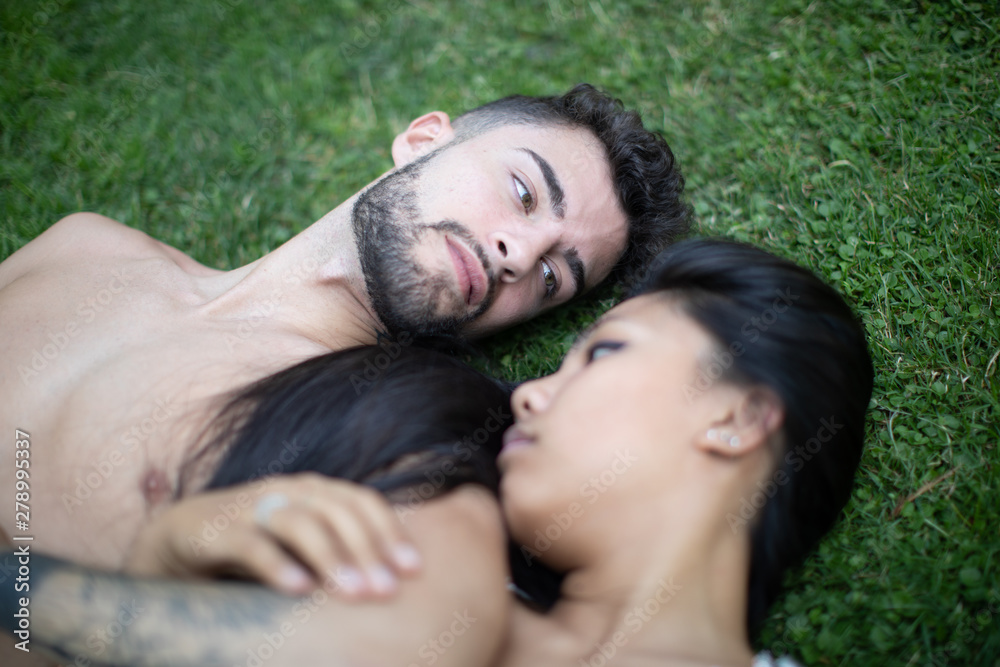 young mix couple asian and European in the park in love young mix couple asian and European in the park in love