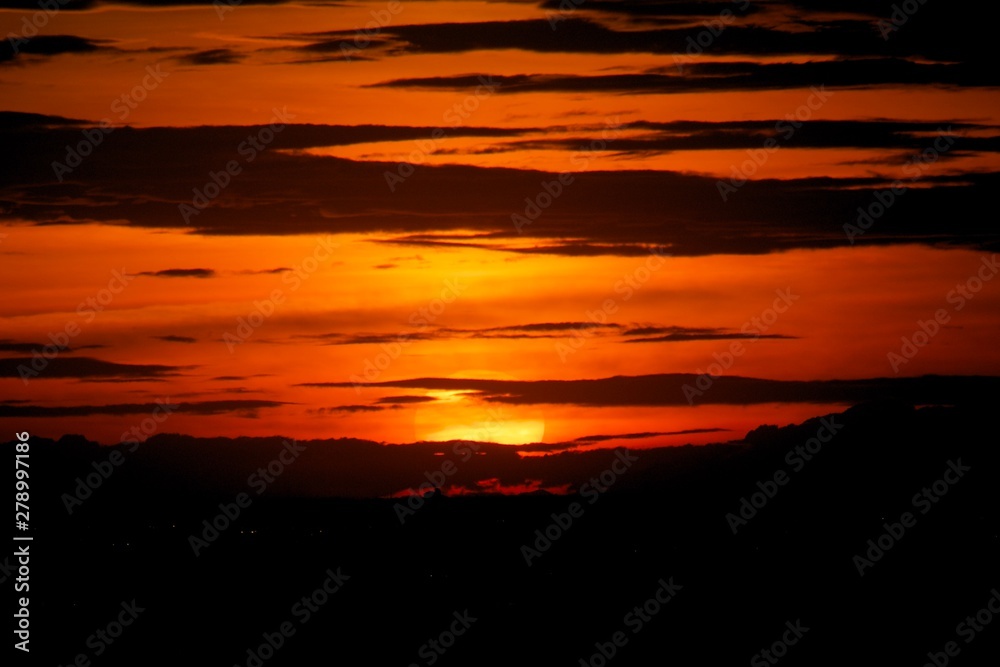 Sunset in darkness cloud background