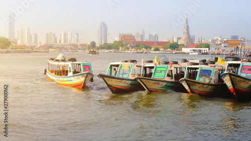 Colorful Passenger Boats at Chao Phraya River, bangkok thailand. © Punyawee