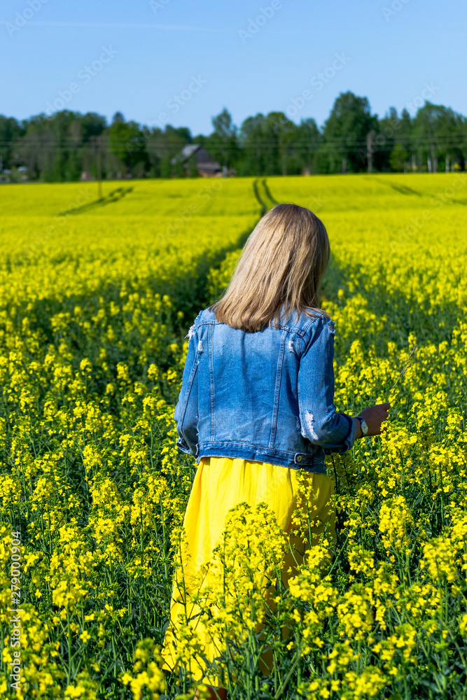 woman in the field of rapeseeds woman in the field of rapeseeds