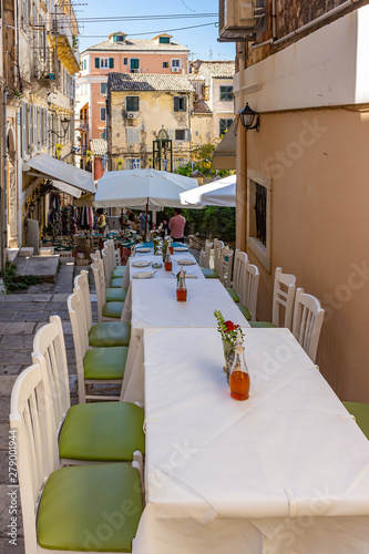 The tables are ready for guests in the small streets of Corfu Town, Corfu, Greece