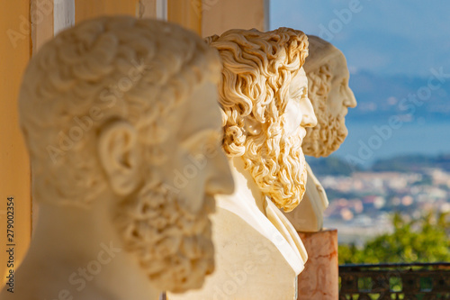A row of three marble busts of men in the Sissi Palace near Gastouri on Corfu, Greece photo
