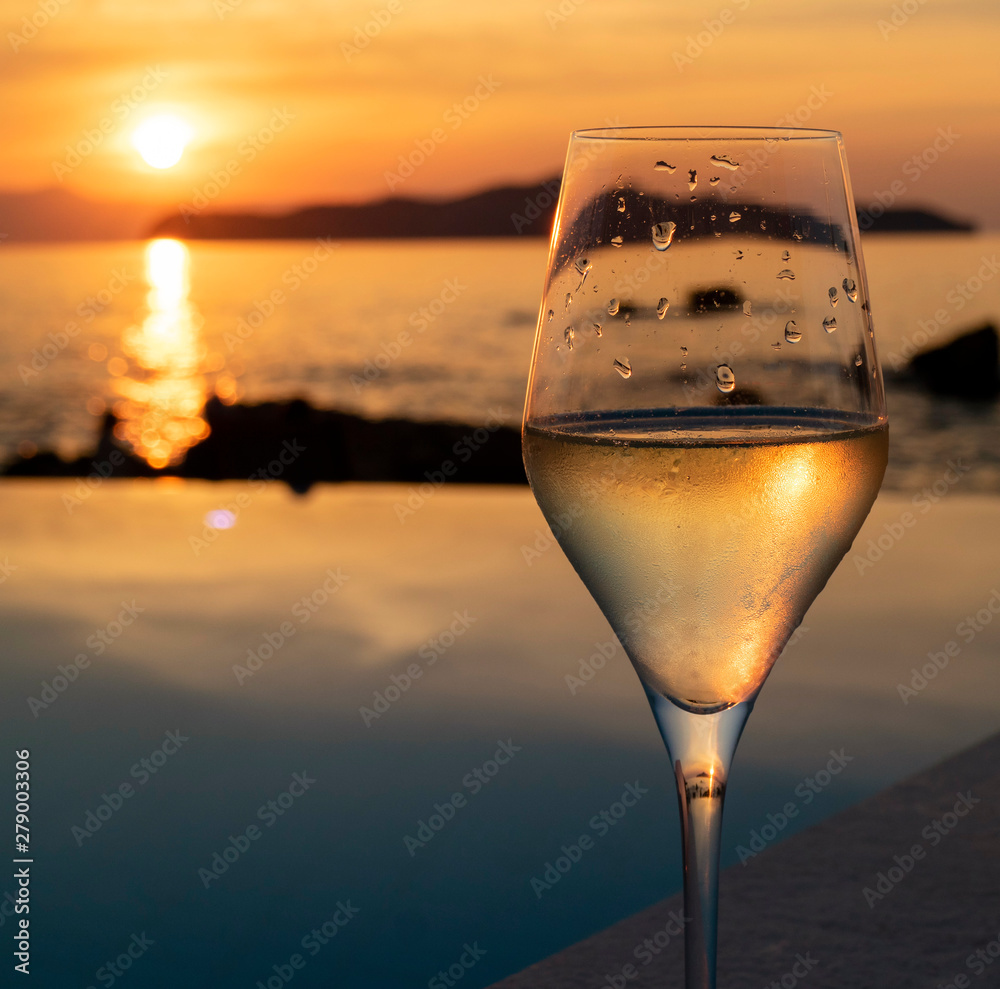 Crete, Greece. June 2019. Sun going down and a glass of sparkling wine.
