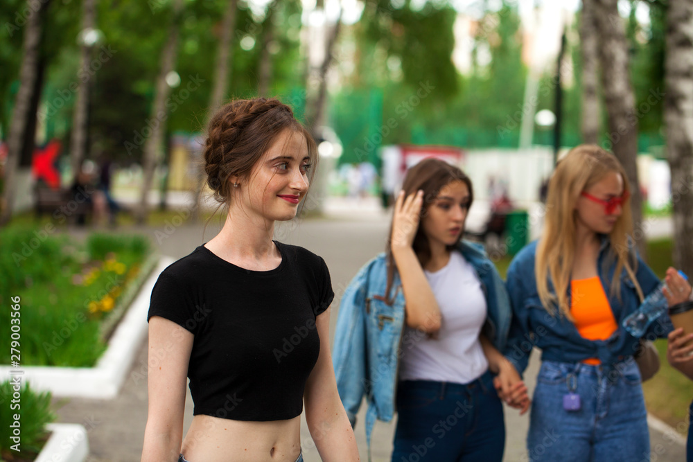 Four schoolgirls in summer park Four schoolgirls in summer park
