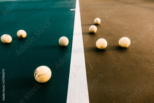 Close up of tennis balls on tennis court photo