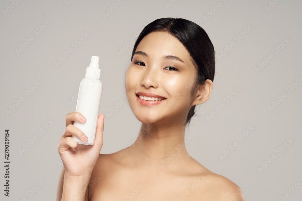 young woman with bottle of water isolated on white young woman with bottle of water isolated on white