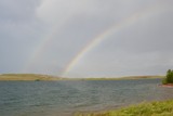 double rainbow over water