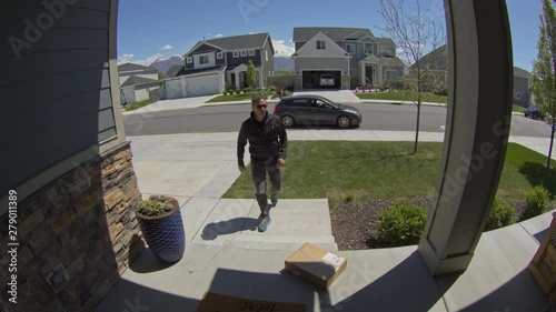 Security camera footage of man stealing package from front stoop / Lehi, Utah, United States