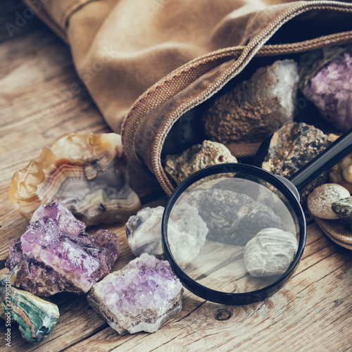 Mineral stones: turquoise, morion, smoky quartz, rhinestone, chalcedony, fluorite, agate, amethyst, onyx, chalcedony and magnifying glass and backpack of geologist.