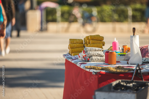 food vendors on the beach, ethnic food as a business profile, corn and vegetables prepared on the grill