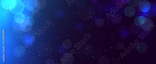 Abstract blurred bokeh blue background with circles. Christmas and New year holiday magic background with snow. Copy space