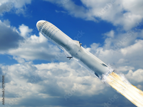 Fototapeta Naklejka Na Ścianę i Meble -  Big rocket flying over blue sky clouds