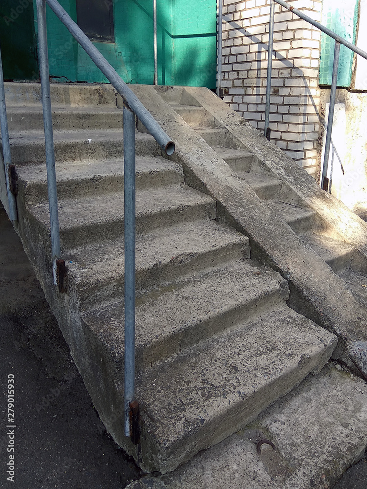 gray concrete staircase in summer day