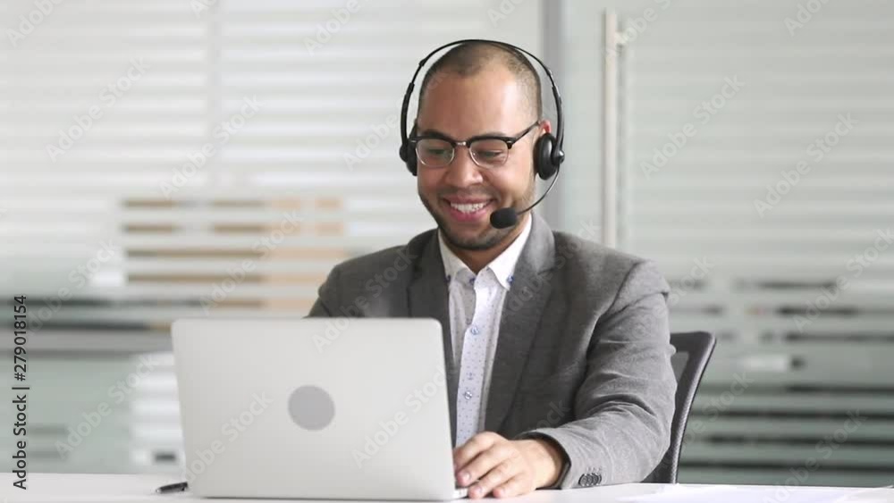 Smiling african american businessman manager talking by video conference call Smiling african american businessman manager talking by video conference call