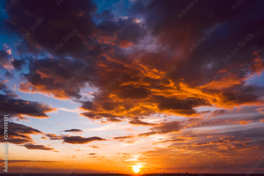 Dramatic orange sky with clouds at sunset - obrazy, fototapety, plakaty 