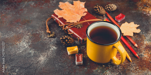 Enameled cup of hot tea photo