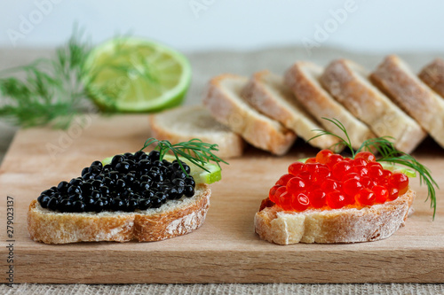 sandwiches with red and black caviar with lime