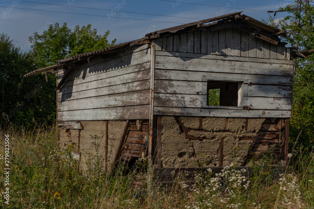 old wooden abandoned grunge house in the middle of the field old wooden abandoned grunge house in the middle of the field